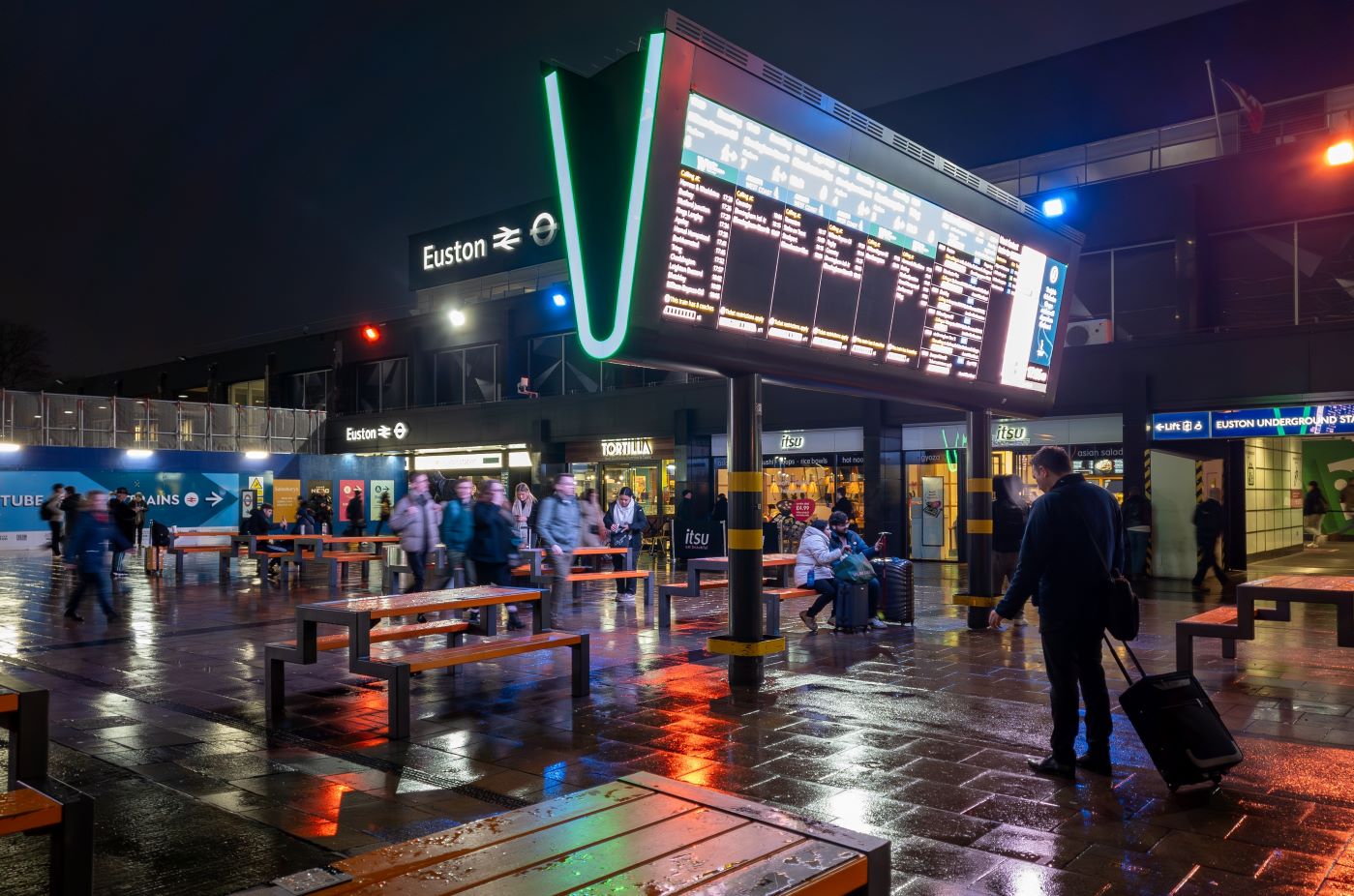 The outside of London Euston station at night